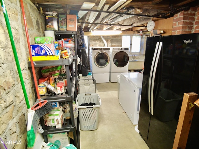 laundry area with separate washer and dryer