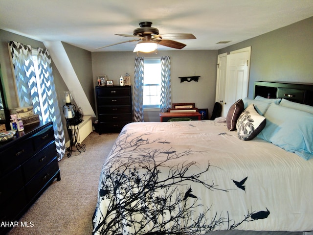 bedroom with light carpet and ceiling fan