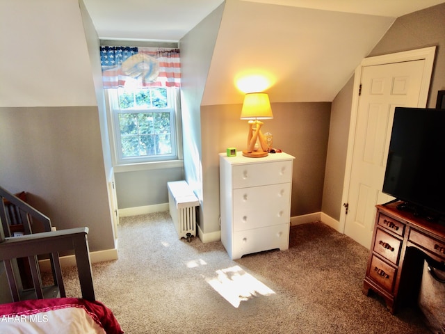 carpeted bedroom featuring lofted ceiling and radiator heating unit