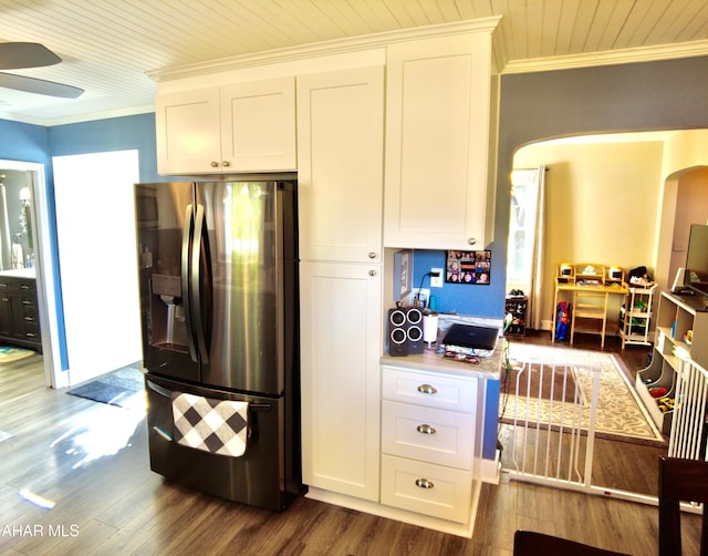 kitchen featuring white cabinets, dark hardwood / wood-style floors, crown molding, and stainless steel refrigerator with ice dispenser