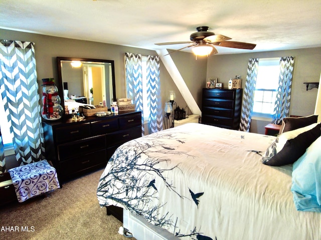 carpeted bedroom with ceiling fan