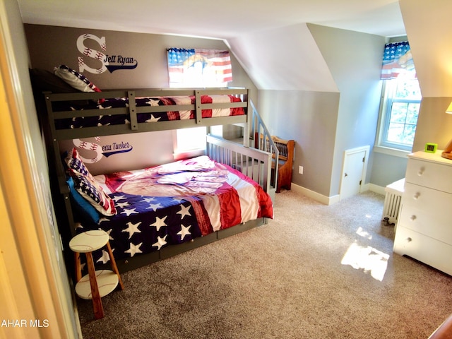 bedroom featuring lofted ceiling and carpet floors