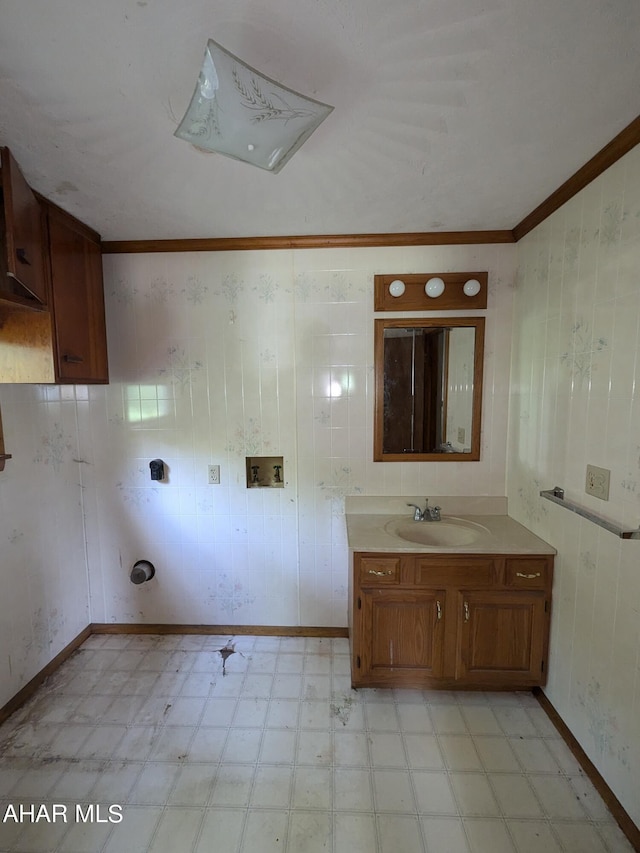 bathroom with vanity and crown molding