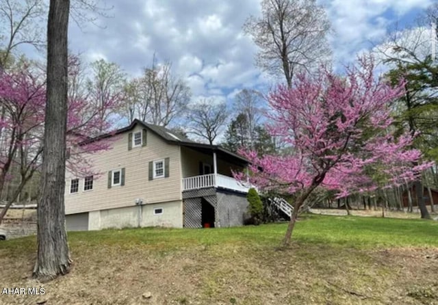 view of home's exterior featuring a lawn