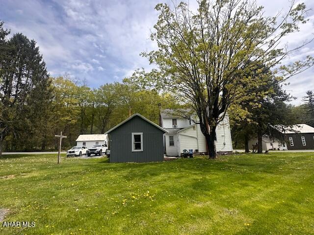 193 Pavia Rd, Imler, PA 16655 - view of side of property featuring a lawn