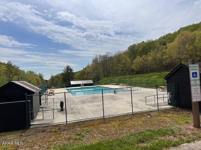 193 Pavia Rd, Imler, PA 16655 - community pool featuring a wooded view