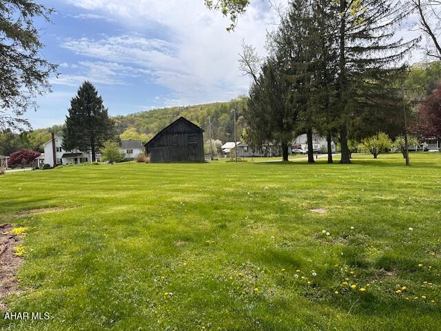 193 Pavia Rd, Imler, PA 16655 - view of grassy yard featuring a barn and an outbuilding