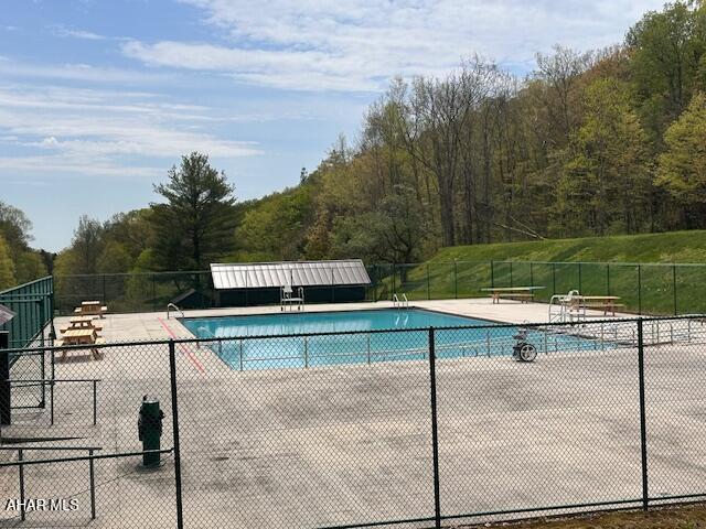 193 Pavia Rd, Imler, PA 16655 - community pool featuring a view of trees and a patio