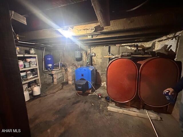 193 Pavia Rd, Imler, PA 16655 - unfinished below grade area with heating fuel, a water pressure tank, and a heating unit