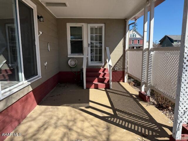 view of patio / terrace with entry steps and fence