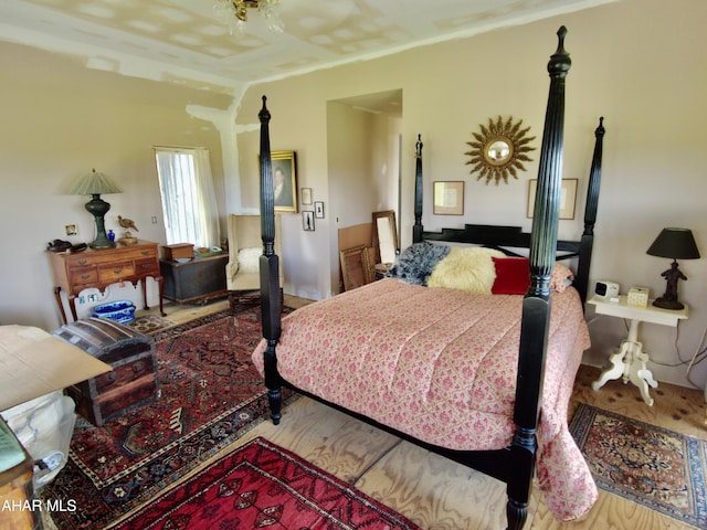 bedroom with hardwood / wood-style floors