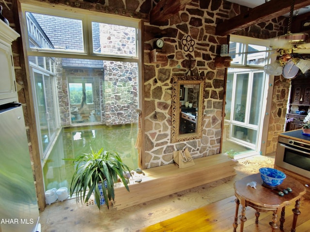 interior space with hardwood / wood-style flooring and ceiling fan