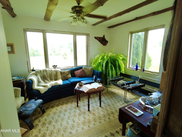 living room with beam ceiling and ceiling fan