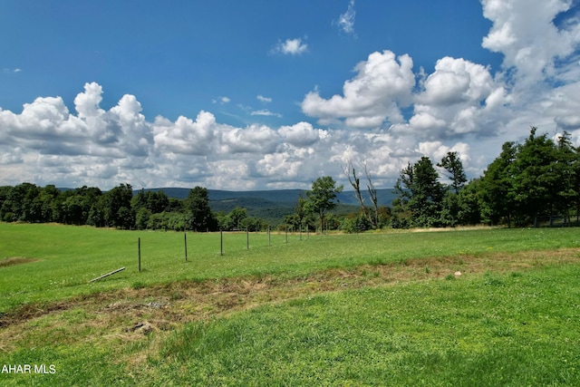 exterior space with a rural view