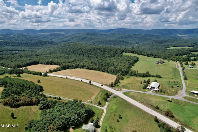 drone / aerial view featuring a mountain view and a rural view