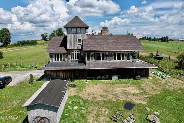 back of property with an outbuilding