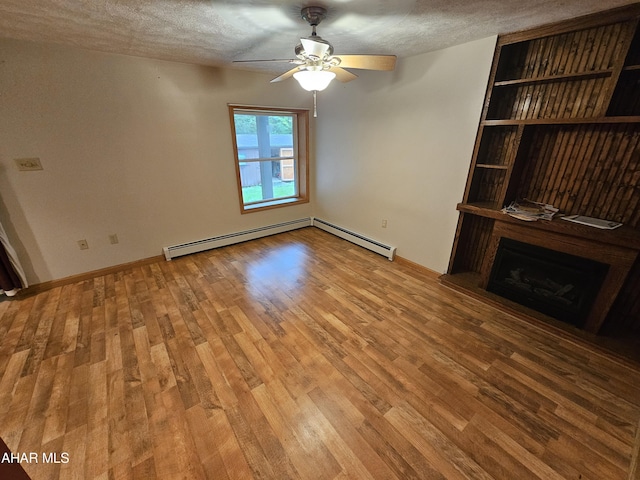 unfurnished living room featuring wood-type flooring, a textured ceiling, a baseboard radiator, and ceiling fan