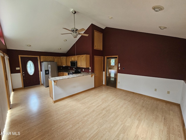 kitchen featuring high vaulted ceiling, ceiling fan, light hardwood / wood-style floors, kitchen peninsula, and stainless steel appliances