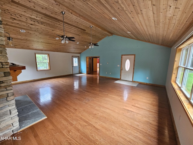 unfurnished living room with lofted ceiling, a stone fireplace, ceiling fan, light wood-type flooring, and wood ceiling