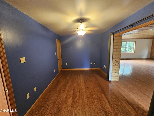 spare room with hardwood / wood-style flooring and ceiling fan