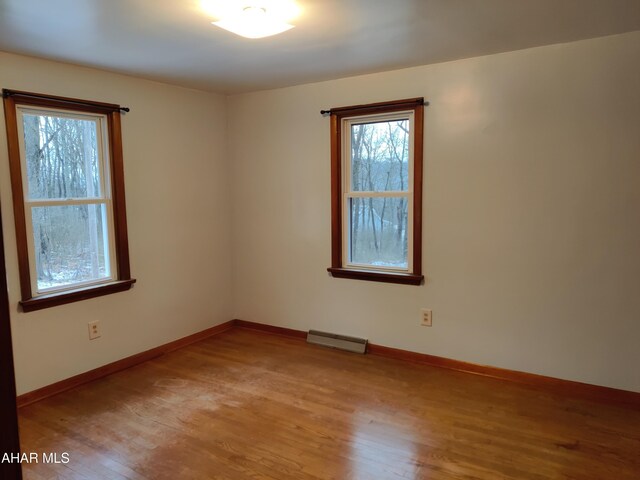 spare room with light hardwood / wood-style floors