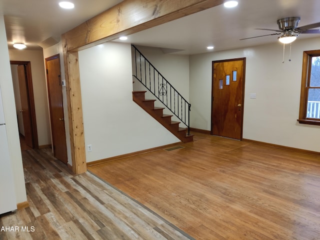 entryway featuring ceiling fan and light wood-type flooring