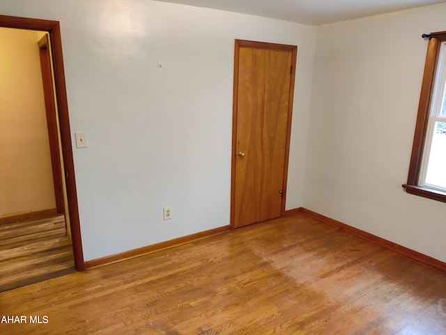 unfurnished room featuring light wood-type flooring