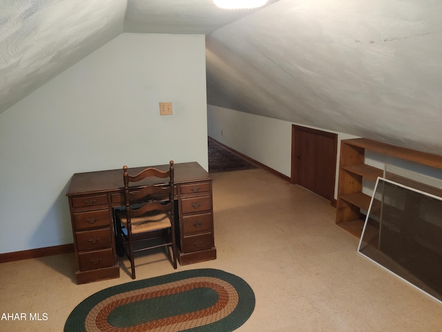 office area featuring lofted ceiling