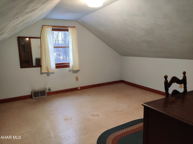 bonus room featuring lofted ceiling