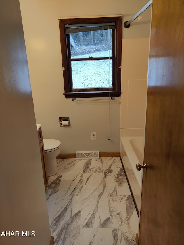 full bathroom featuring vanity, toilet, and washtub / shower combination