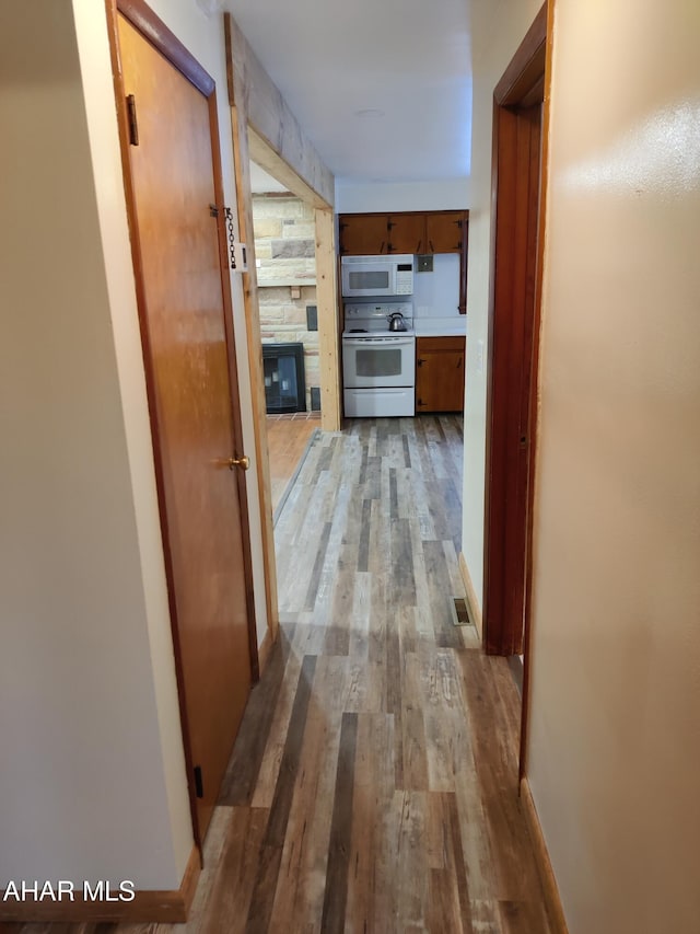 hall with light wood-type flooring