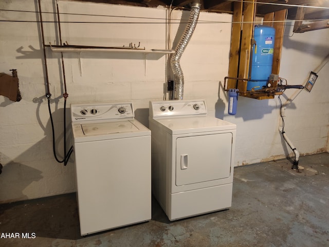 clothes washing area with independent washer and dryer