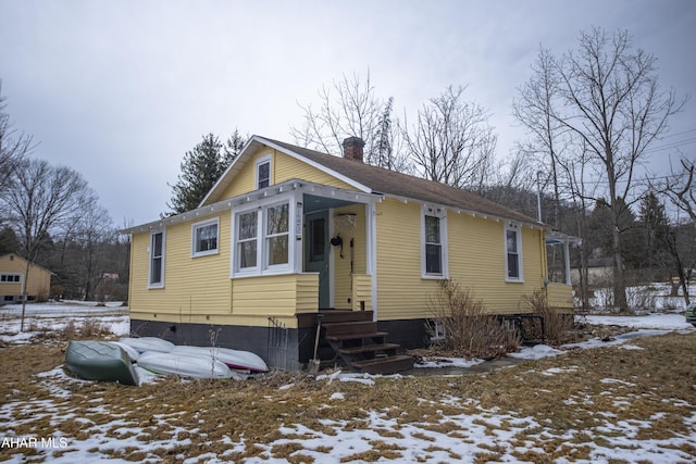 view of front of property featuring a chimney