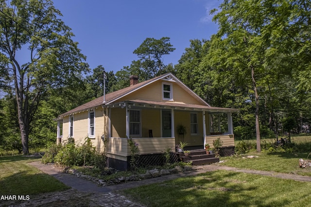 143 Rider Farm Rd, Altoona, PA 16601 - view of front facade featuring a porch, a chimney, and a front yard