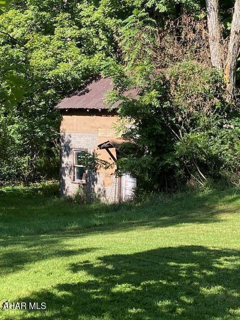 143 Rider Farm Rd, Altoona, PA 16601 - view of home's exterior with a yard and an outdoor structure