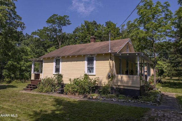143 Rider Farm Rd, Altoona, PA 16601 - view of home's exterior with a lawn, a chimney, and roof with shingles