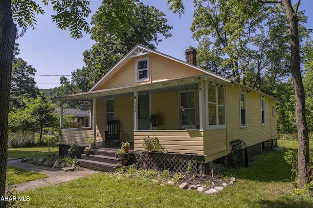 143 Rider Farm Rd, Altoona, PA 16601 - view of front of property featuring a chimney, a front yard, and a porch