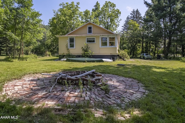 143 Rider Farm Rd, Altoona, PA 16601 - back of property featuring an outdoor fire pit, a yard, and a patio area