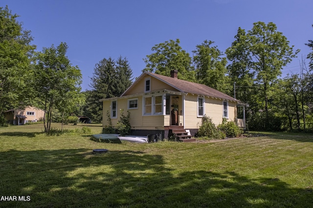 143 Rider Farm Rd, Altoona, PA 16601 - back of property featuring a chimney and a lawn