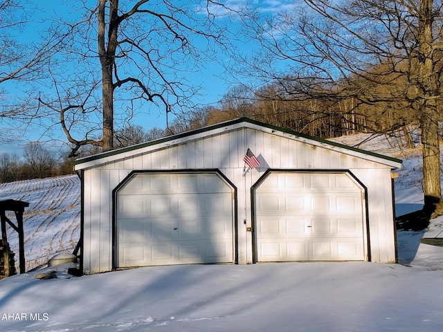 view of snow covered garage