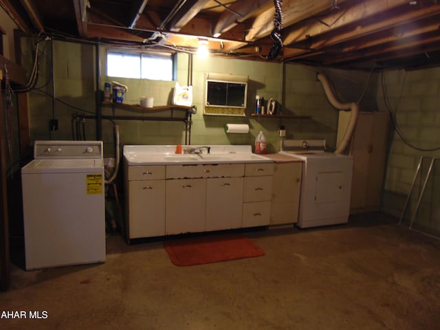 basement with sink and washing machine and clothes dryer