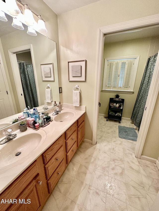 bathroom with vanity and a chandelier