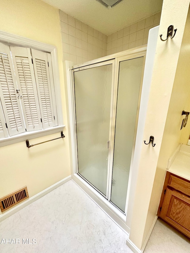 bathroom featuring walk in shower