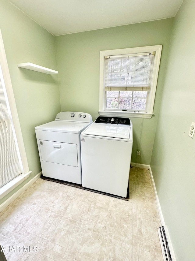 washroom featuring washing machine and dryer