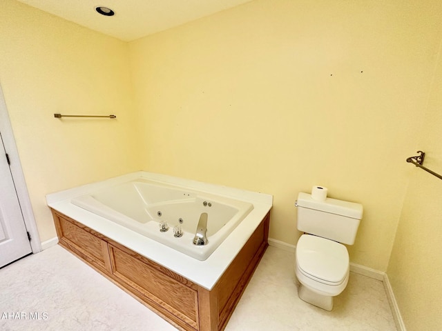 bathroom with toilet and a bath