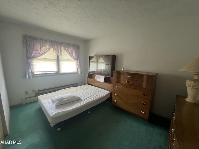 carpeted bedroom with baseboard heating and a textured ceiling