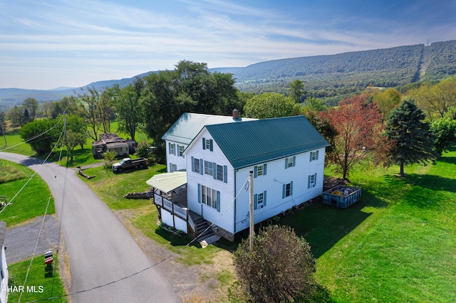 birds eye view of property with a mountain view