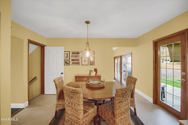 dining space with light colored carpet and a healthy amount of sunlight