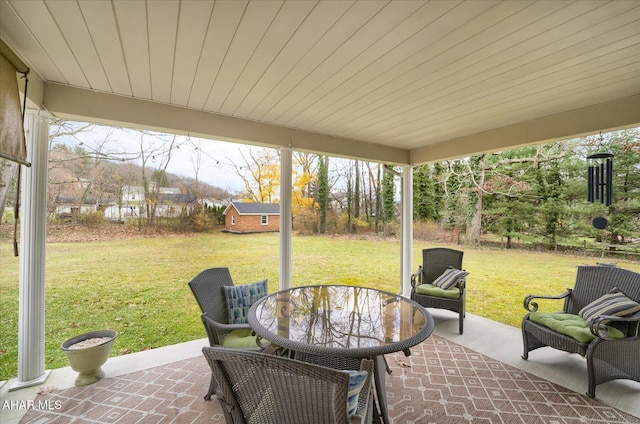 view of patio with an outbuilding