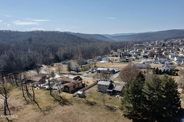 bird's eye view with a wooded view and a mountain view